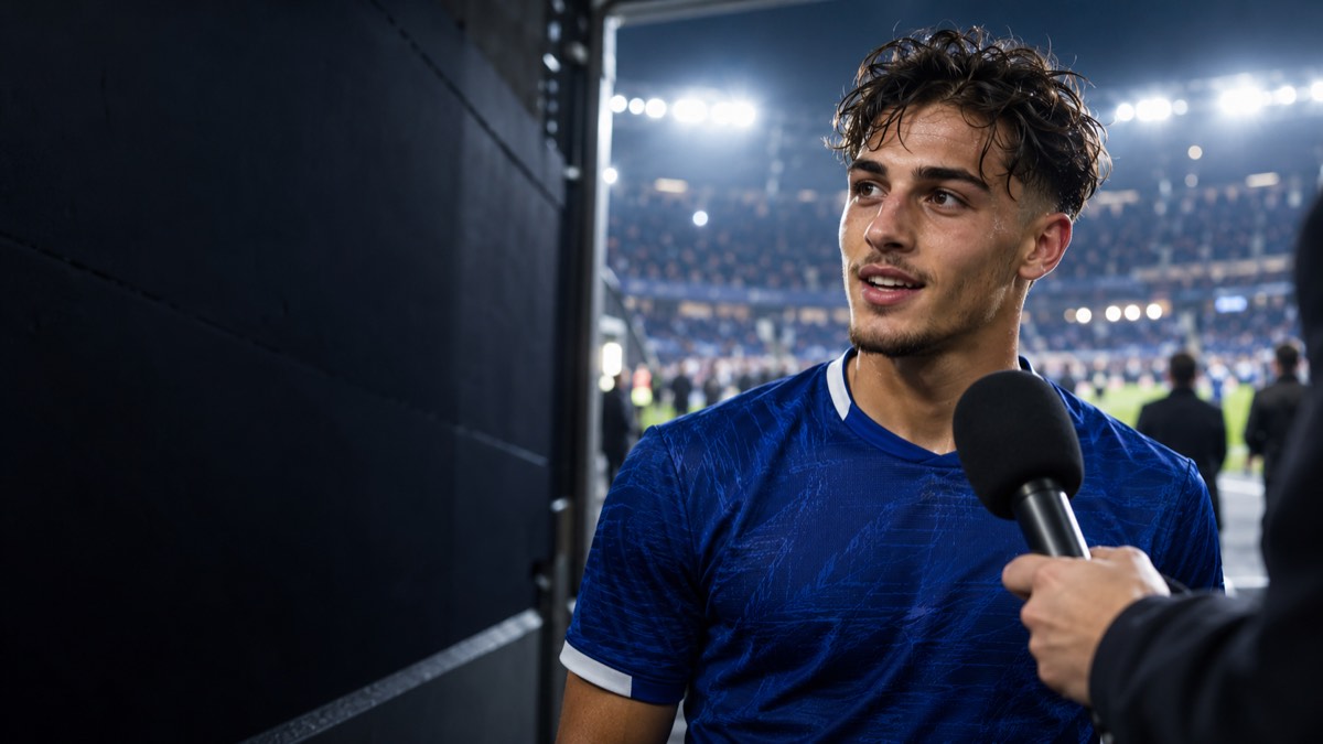 Editorial illustration of a generic footballer speaking into a microphone in a stadium tunnel